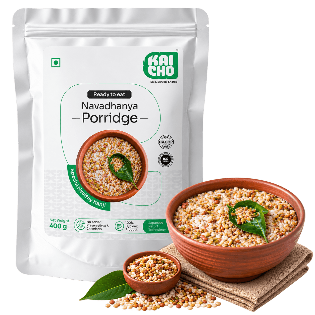 Kaicho Veg Oats Porridge pouch beside a served bowl of porridge garnished with coriander, next to a wooden spoon
